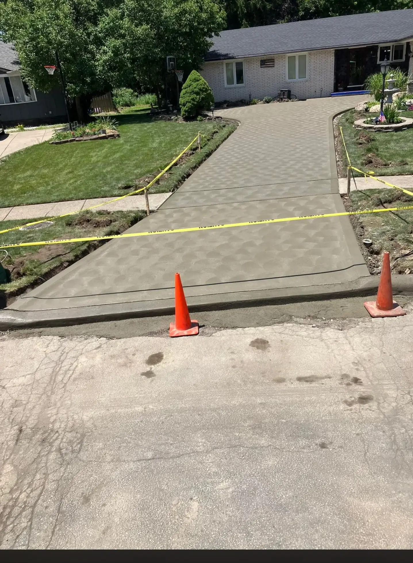 Concrete driveway replacement with forms set and fresh flatwork poured