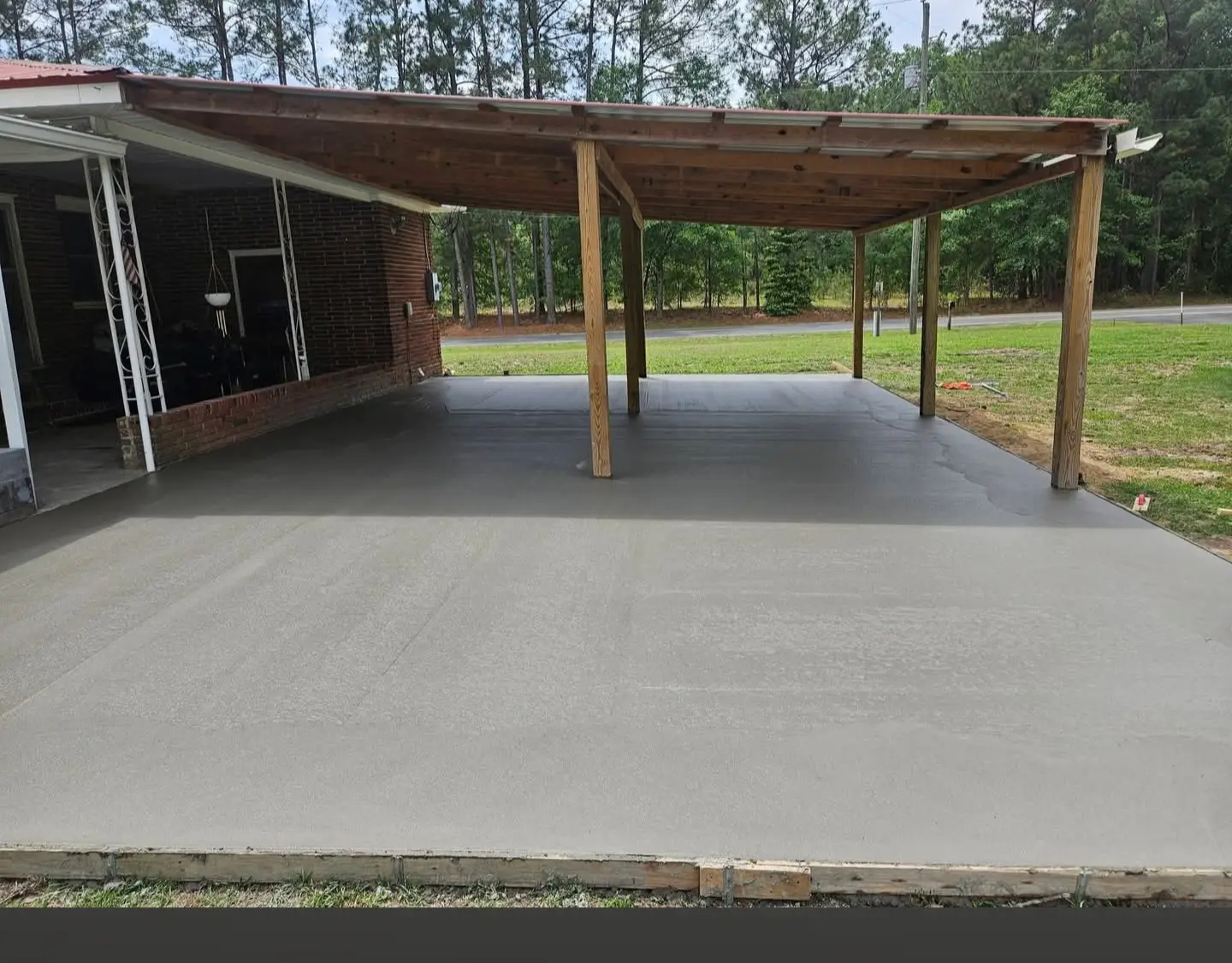 Finished concrete slab under a covered backyard patio