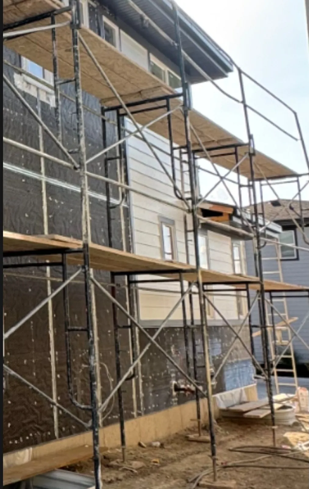 Exterior hardcoat stucco lath and mesh preparation with scaffolding