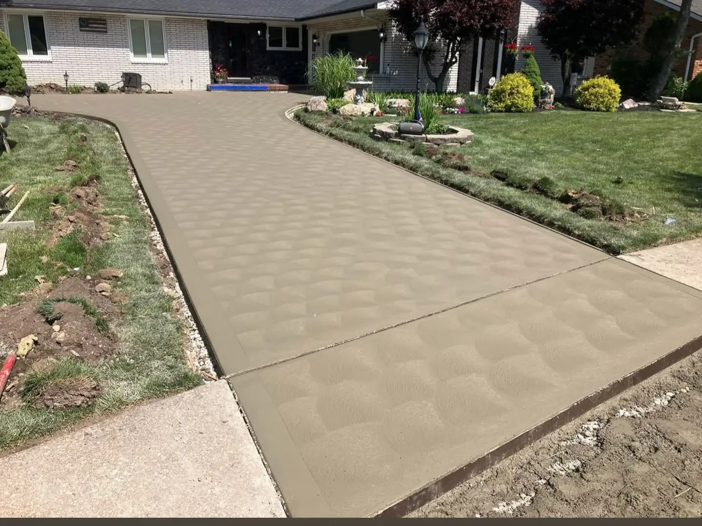 Stamped concrete driveway and front walk finished at a Northern Utah home